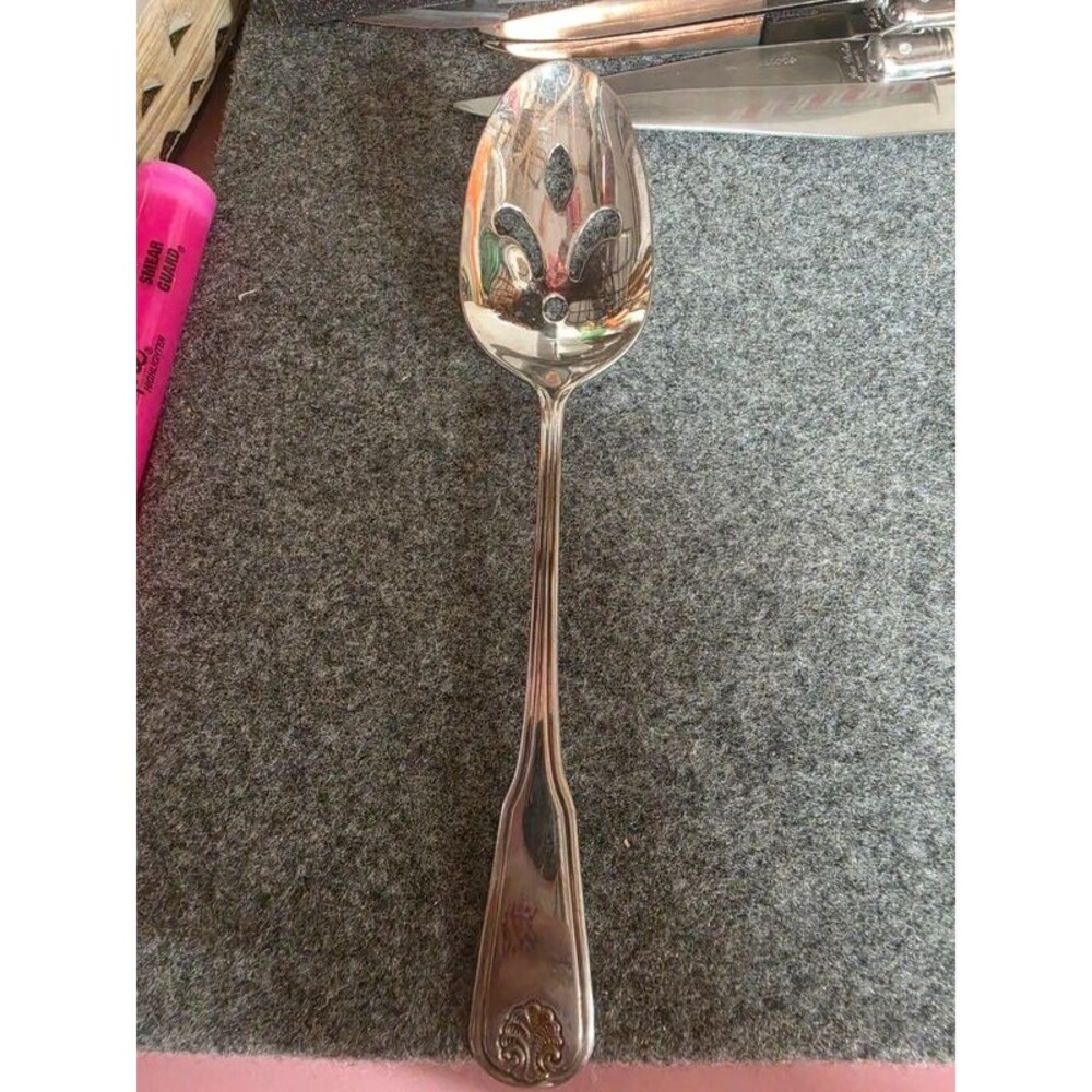 Vintage stainless steel serving spoon